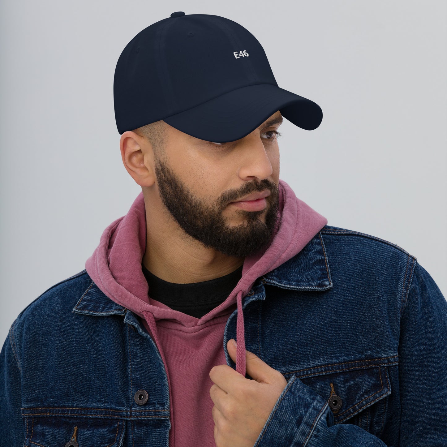 a man with a beard wearing a hat