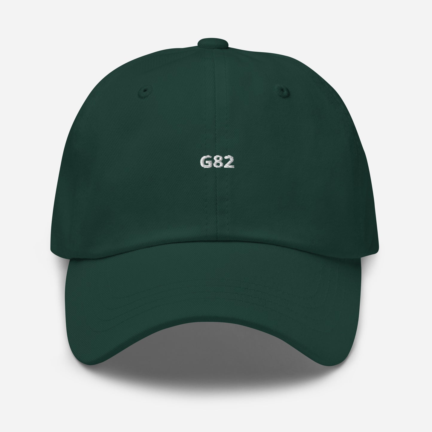 a green baseball cap with the BMW Chassis G82 embroidered on it