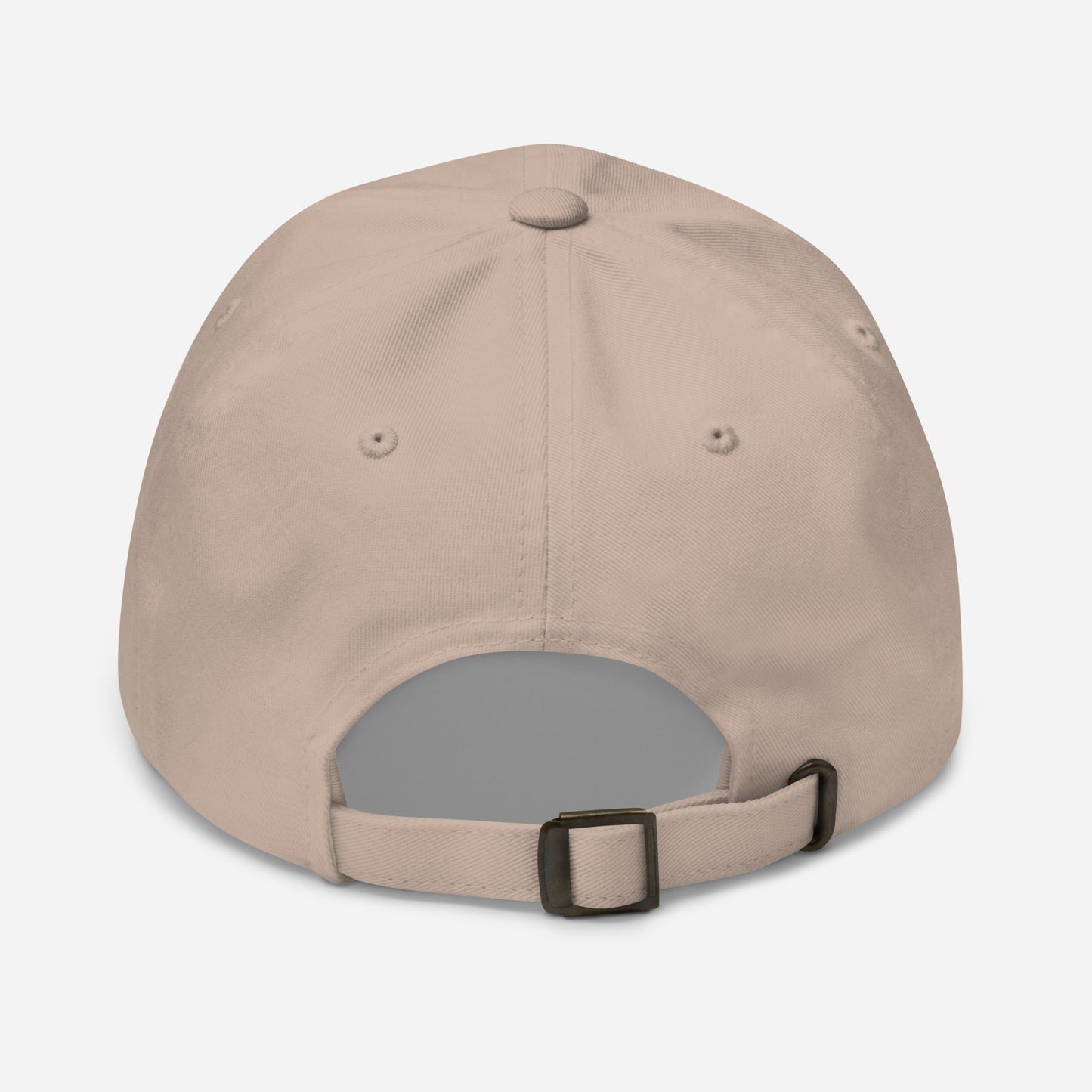 a beige hat with a black buckle on the side