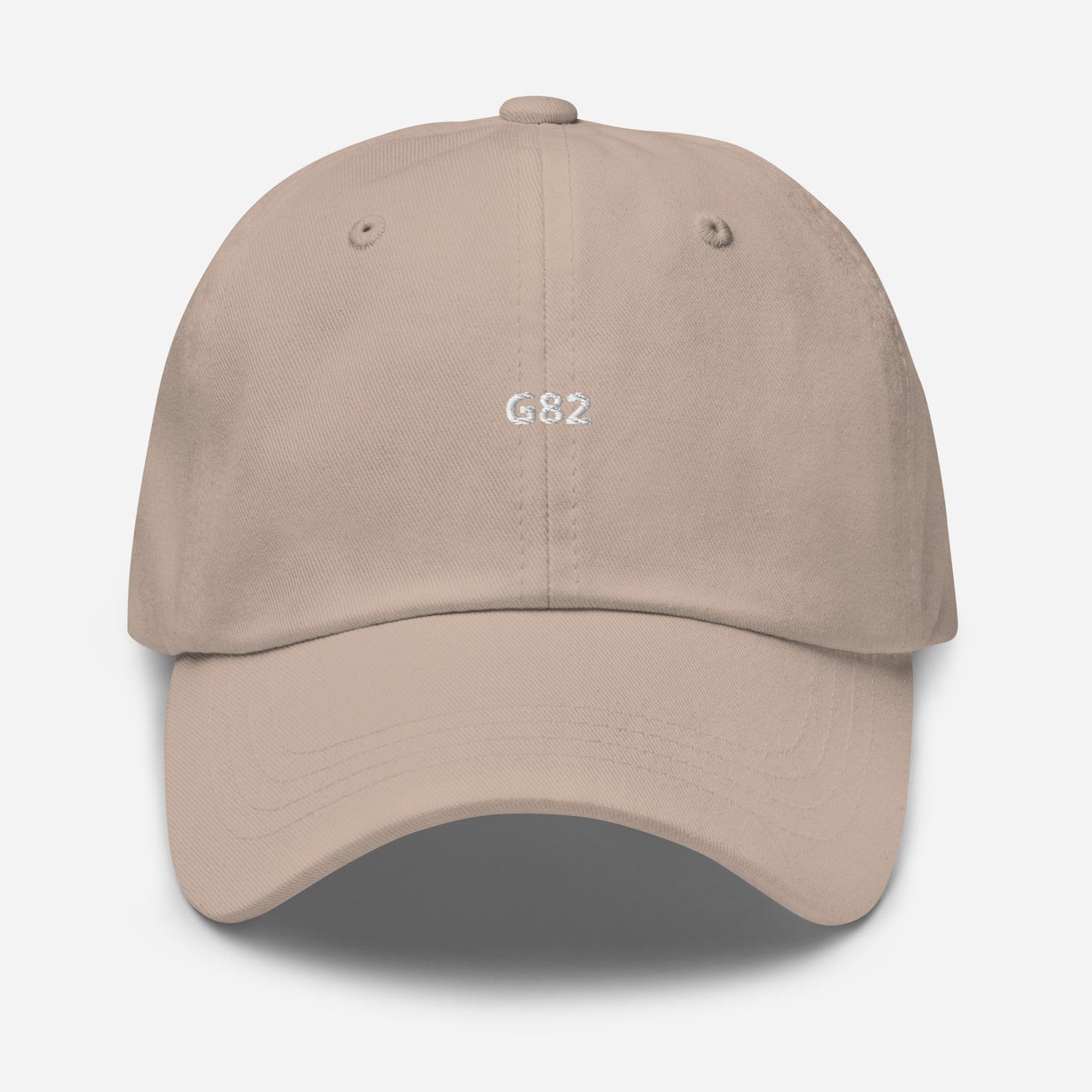 a beige baseball cap with the BMW Chassis G82 embroidered on it